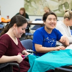 two women making crafts